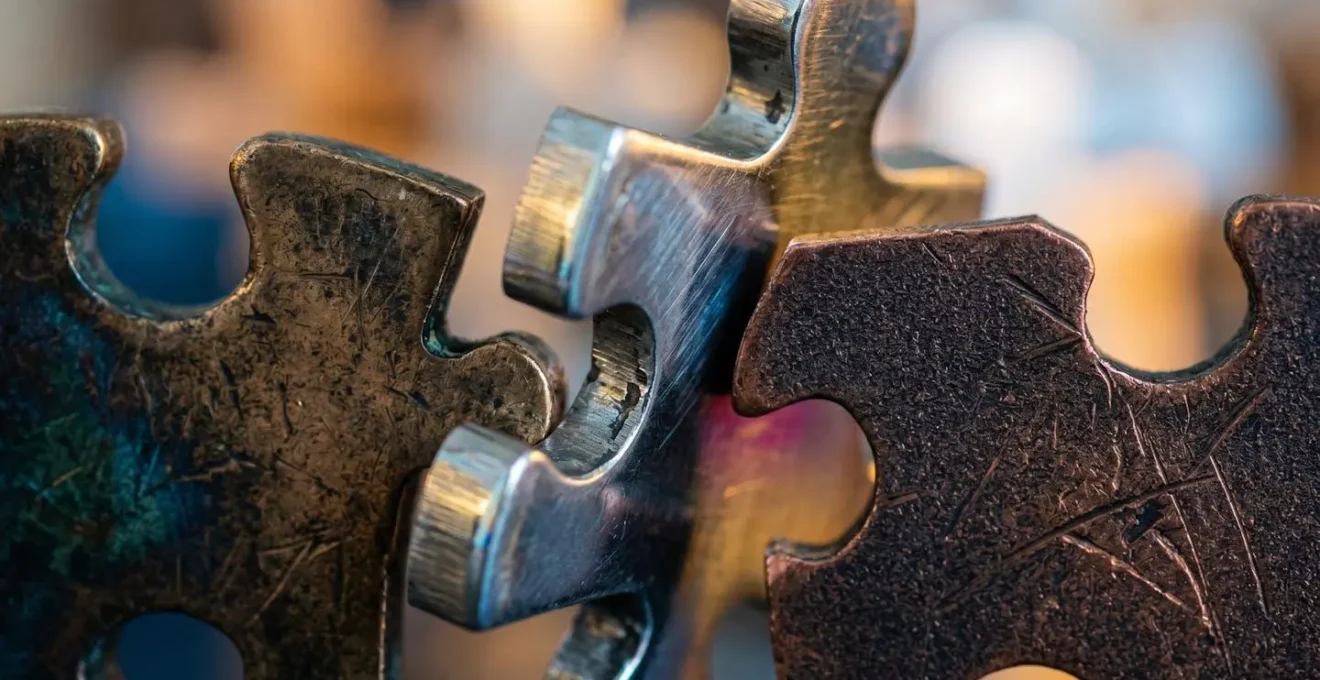 Macro shot of disconnected puzzle pieces representing data fragmentation