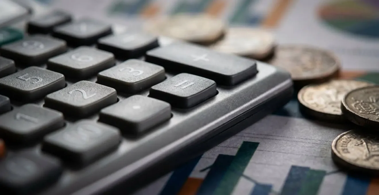 Extreme close-up of financial tracking tools and calculator buttons